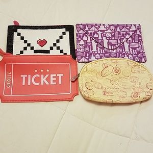 4 travel themed makeup bags